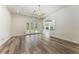 Hardwood floors in an open-concept living space leading to pool with an adjacent kitchen at 1638 Whitney Isles Dr, Windermere, FL 34786