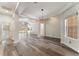 Spacious open-concept living space with hardwood floors and access to an adjacent room at 1638 Whitney Isles Dr, Windermere, FL 34786