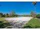 Scenic sand volleyball court near a lake and grassy lawn at 1638 Whitney Isles Dr, Windermere, FL 34786