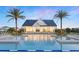Stunning community pool featuring a modern clubhouse and ample lounging space at 1664 Crowncrest Dr, Apopka, FL 32703