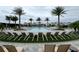 Outdoor swimming pool surrounded by sun loungers, umbrellas, and palm trees at 1664 Crowncrest Dr, Apopka, FL 32703
