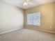 Comfortable bedroom with plush carpet and a large window creating a relaxing and peaceful atmosphere at 1810 Shadow View Cir # 1810, Maitland, FL 32751