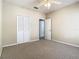 Bedroom with carpet flooring, closet, and access to the next room at 1810 Shadow View Cir # 1810, Maitland, FL 32751