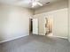 Open bedroom with two doorways, carpet, and a ceiling fan at 1810 Shadow View Cir # 1810, Maitland, FL 32751