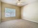 Inviting bedroom with neutral carpet, a ceiling fan, and a window offering natural light at 1810 Shadow View Cir # 1810, Maitland, FL 32751