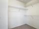 Walk-in closet with shelving for storage space at 1810 Shadow View Cir # 1810, Maitland, FL 32751