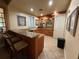 Clubhouse bar area featuring a granite countertop, bar seating, cabinets, a sink, and drinkware storage at 1810 Shadow View Cir # 1810, Maitland, FL 32751