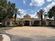 Clubhouse with circular drive, mature palm trees, and meticulous landscaping at 1810 Shadow View Cir # 1810, Maitland, FL 32751