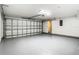 Spacious garage with a painted floor and a large automatic garage door at 1810 Shadow View Cir # 1810, Maitland, FL 32751