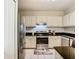 Modern kitchen with stainless steel appliances and white cabinets at 1810 Shadow View Cir # 1810, Maitland, FL 32751