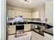 Modern kitchen with stainless steel appliances and white cabinets at 1810 Shadow View Cir # 1810, Maitland, FL 32751