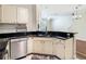 Charming kitchen featuring granite counters, white cabinets, and stainless steel dishwasher at 1810 Shadow View Cir # 1810, Maitland, FL 32751