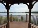 Relaxing lake view from the gazebo, framed by its structure, adding to the community's natural beauty at 1810 Shadow View Cir # 1810, Maitland, FL 32751