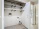 This laundry area has built in shelves, washer/dryer hookups and tile floor at 1810 Shadow View Cir # 1810, Maitland, FL 32751