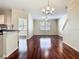 Open-concept living space featuring hardwood floors and a kitchen area at 1810 Shadow View Cir # 1810, Maitland, FL 32751