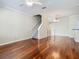 Open-concept living space with hardwood floors, stairs, and a view of the adjacent kitchen area at 1810 Shadow View Cir # 1810, Maitland, FL 32751