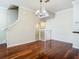 Spacious living room with hardwood floors and staircase to the upper level at 1810 Shadow View Cir # 1810, Maitland, FL 32751