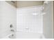 Bathroom shower and tub combination featuring bright white tile at 1810 Shadow View Cir # 1810, Maitland, FL 32751