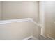 Close-up view of a neutral staircase with carpet and white trim, adding to the home's charm at 1810 Shadow View Cir # 1810, Maitland, FL 32751