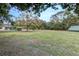 Spacious backyard with ample room for recreation and relaxation, with a shed on the left at 205 Elaine Pl, Chuluota, FL 32766
