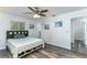 Clean bedroom featuring hardwood floors, white walls, and overhead lighting at 205 Elaine Pl, Chuluota, FL 32766