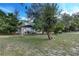 Beautiful home situated on a large lot with mature trees and well-maintained landscaping at 205 Elaine Pl, Chuluota, FL 32766