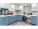 Well-appointed kitchen featuring shaker cabinets, stainless steel appliances, and modern finishes at 205 Elaine Pl, Chuluota, FL 32766