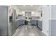 Spacious kitchen with modern stainless steel appliances, granite countertops, and ample storage space at 205 Elaine Pl, Chuluota, FL 32766