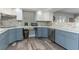 Well-lit kitchen showcasing granite counters, stainless steel appliances, and updated cabinetry at 205 Elaine Pl, Chuluota, FL 32766