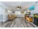 Comfortable living room featuring hardwood floors, ceiling fan, and natural lighting at 205 Elaine Pl, Chuluota, FL 32766