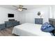 Main bedroom features hardwood floors, white walls, and furniture at 205 Elaine Pl, Chuluota, FL 32766