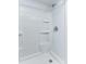 Bathroom showcasing a walk-in shower with a white tile backsplash at 205 Elaine Pl, Chuluota, FL 32766