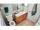 Bathroom with a vanity, commode and shower with tiled floor at 2343 Walnut Heights Rd, Apopka, FL 32703