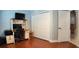 Bedroom featuring a built in desk, a large closet, and vinyl flooring at 2343 Walnut Heights Rd, Apopka, FL 32703