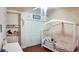 Adorable bedroom with themed decor, wood-look floors and built-in shelving for stuffed animal display at 2343 Walnut Heights Rd, Apopka, FL 32703