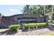 Wekiva Club brick entrance sign surrounded by trimmed shrubs and foliage at 2343 Walnut Heights Rd, Apopka, FL 32703