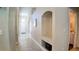 Inviting foyer with neutral paint, tiled floors, high ceilings, arched doorways, and recessed niche at 2343 Walnut Heights Rd, Apopka, FL 32703