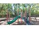 Playground with slides and climbing area surrounded by a wood chip safety area at 2343 Walnut Heights Rd, Apopka, FL 32703