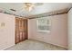 Bedroom with a closet, ceiling fan, and natural light from the window at 2409 Pinyon Ct, Kissimmee, FL 34746