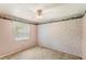 Bedroom with a ceiling fan and natural light from the window at 2409 Pinyon Ct, Kissimmee, FL 34746