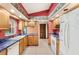 Kitchen with wood cabinetry, tile floors and plenty of countertop space at 2409 Pinyon Ct, Kissimmee, FL 34746