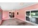 Enclosed lanai with carpet and sliding glass doors to the outside at 2409 Pinyon Ct, Kissimmee, FL 34746