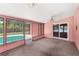 Enclosed lanai with a view of a swimming pool through sliding glass doors at 2409 Pinyon Ct, Kissimmee, FL 34746