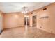 Spacious living room featuring wood floors, a ceiling fan, and neutral peach-colored walls at 2409 Pinyon Ct, Kissimmee, FL 34746