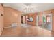 Spacious living room with sliding glass doors leading to an outdoor patio at 2409 Pinyon Ct, Kissimmee, FL 34746