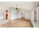 Open-concept living area with hardwood floors and plenty of natural light at 2409 Pinyon Ct, Kissimmee, FL 34746