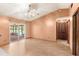 Living room with a view of the pool and outdoor patio at 2409 Pinyon Ct, Kissimmee, FL 34746