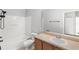 Bright bathroom featuring a shower-tub combo, toilet, and a vanity with a sink and a mirror at 2430 Little Gem Loop, Sanford, FL 32773