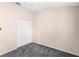 A serene bedroom featuring carpet flooring and a closet; functional and calming space at 2430 Little Gem Loop, Sanford, FL 32773