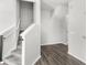 A well-lit entryway with hardwood flooring and a staircase leading to the upper level at 2430 Little Gem Loop, Sanford, FL 32773